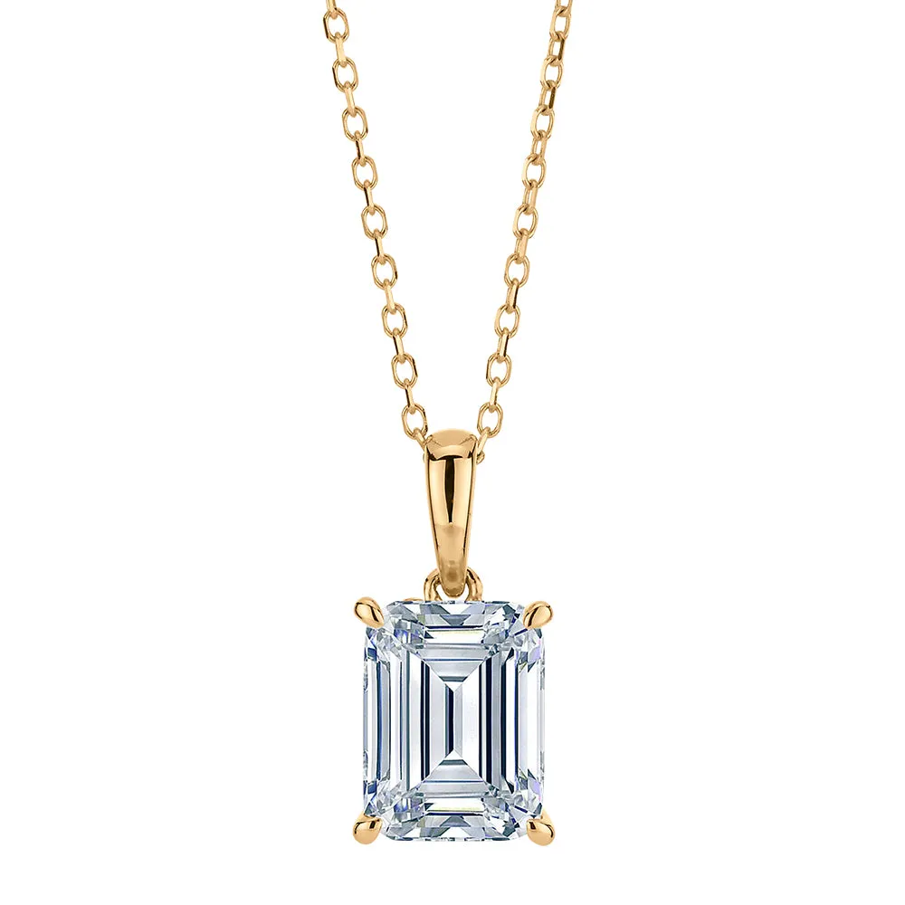 Emerald Cut and Round Brilliant solitaire pendant with 1.81 carats* of diamond simulants in 10 carat yellow gold