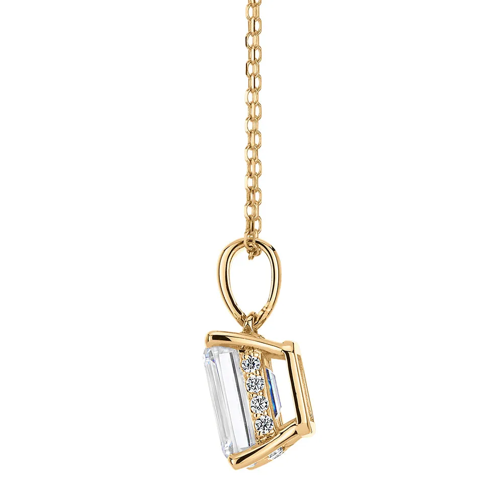 Emerald Cut and Round Brilliant solitaire pendant with 1.81 carats* of diamond simulants in 10 carat yellow gold